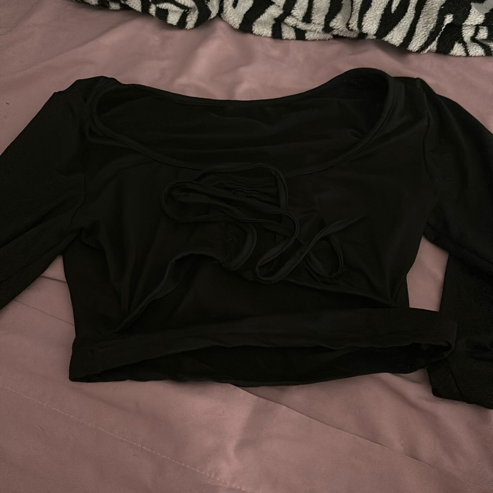 long sleeve shirt with cut at bottom